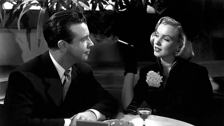 Monroe in all black on a date with a man 