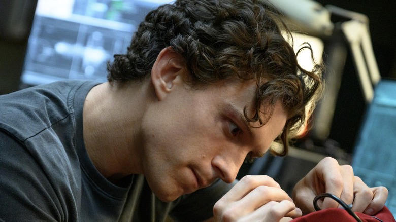 Peter Parker repairing costume in Spider-Man: Brand New Day