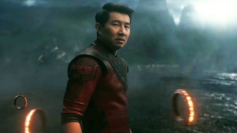 Shang-Chi standing amongst rings in "Shang-Chi and the Legend of the Ten Rings" (2021)