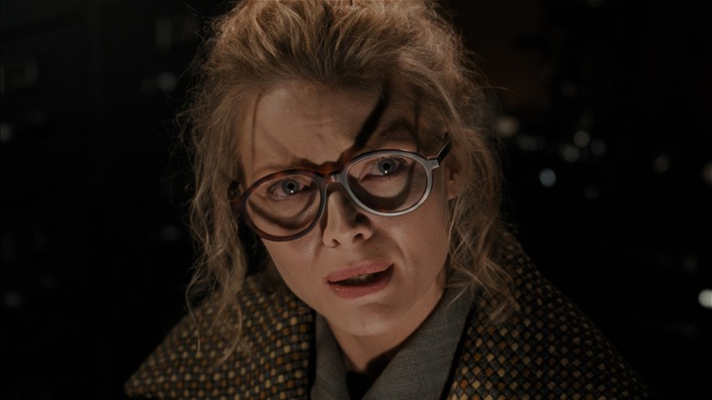 Selina Kyle looking scared in glasses