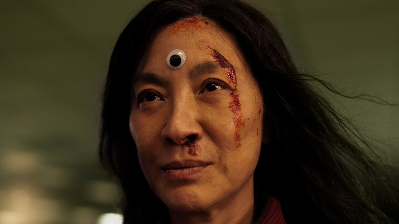 Michelle Yeoh with googly eye on forehead