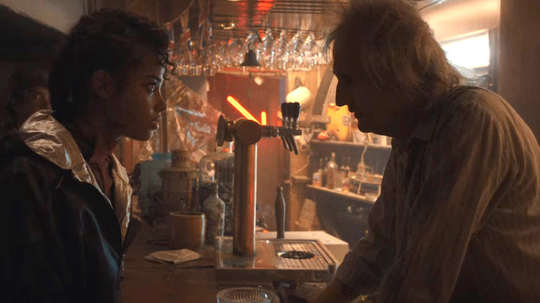 Jade Wesker talking to bartender