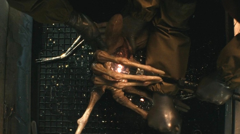 A Xenomorph facehugger getting dissected by Kirsh in his lab