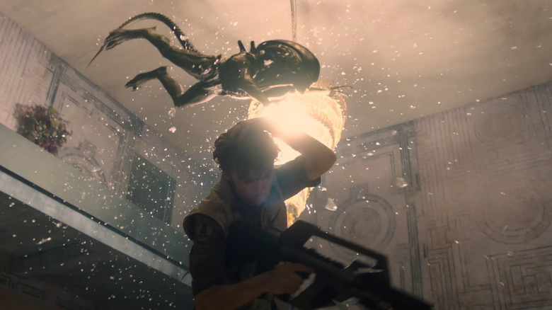 A fully-grown Xenomorph jumping over a balcony to attack Joe Hermit