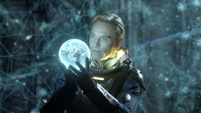 David holds up a hologram of an alien planet in Prometheus