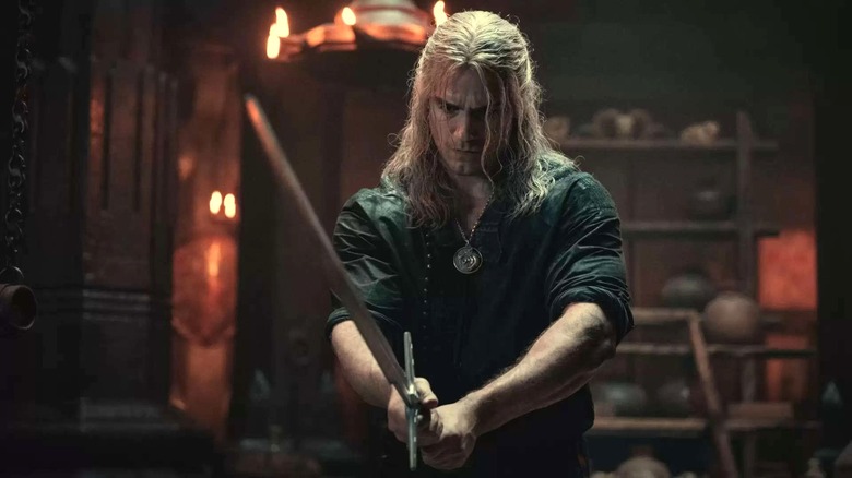 Geralt brandishes his sword