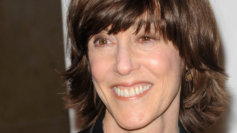 Nora Ephron smiles.