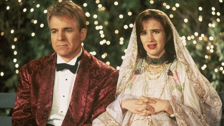Steve Martin smiles politely.