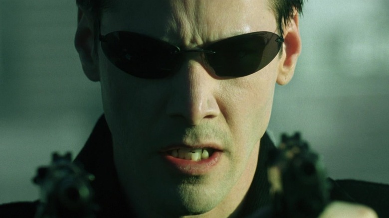 Keanu Reeves Neo wearing sunglasses