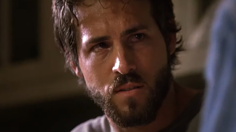 Sweaty Ryan Reynolds looks upset