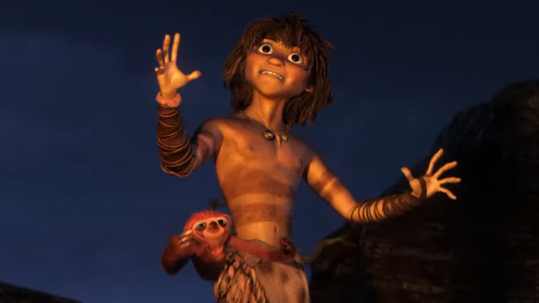 An animated prehistoric man with an animal around his waist