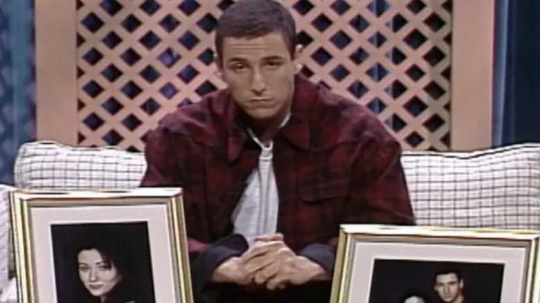 Adam Sandler cries on a couch