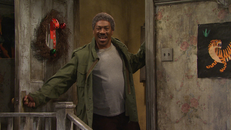 Eddie Murphy enters as Mr. Robinson