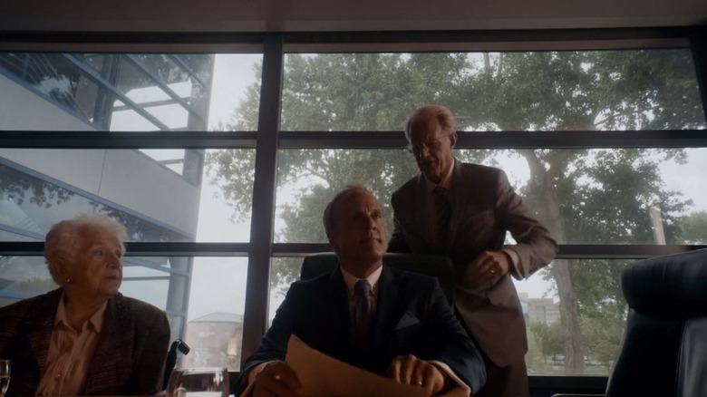 Howard addresses a conference room angrily 