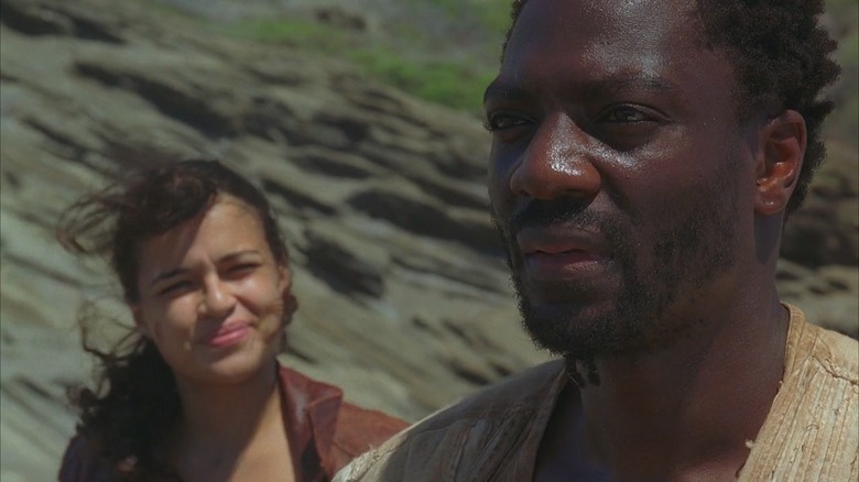 Mr. Eko and Ana Lucia standing on a rock near the sea in Season 2 of "Lost"