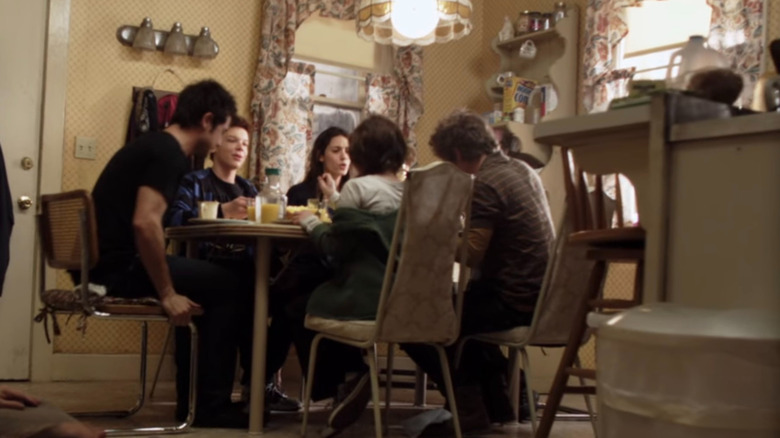 The Gallaghers enjoying breakfast as Frank sleeps on the floor