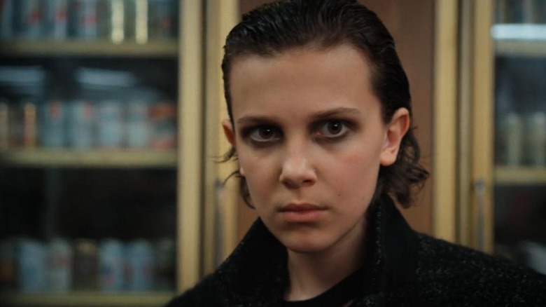 Eleven wearing black clothes and smoky eye on "Stranger Things" (2016-2025)