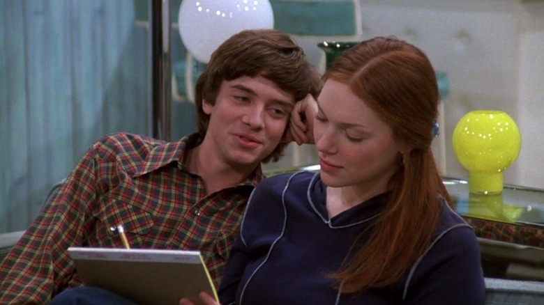 Eric looks lovingly