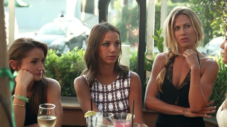 Rachel Kristen and Vail looking skeptically at someone on the SUR patio on Vanderpump Rules