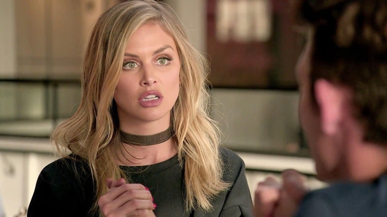 Lala wearing a choker looking shocked at James on Vanderpump Rules