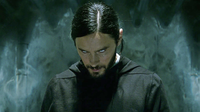 Morbius bows his head as his eyes turn white in "Morbius" (2022)