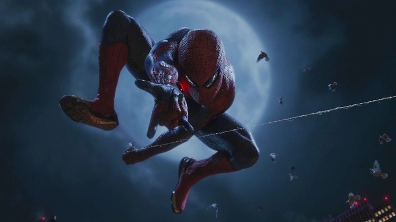 Spider-Man swings in front of moon in "The Amazing Spider-Man" (2012)