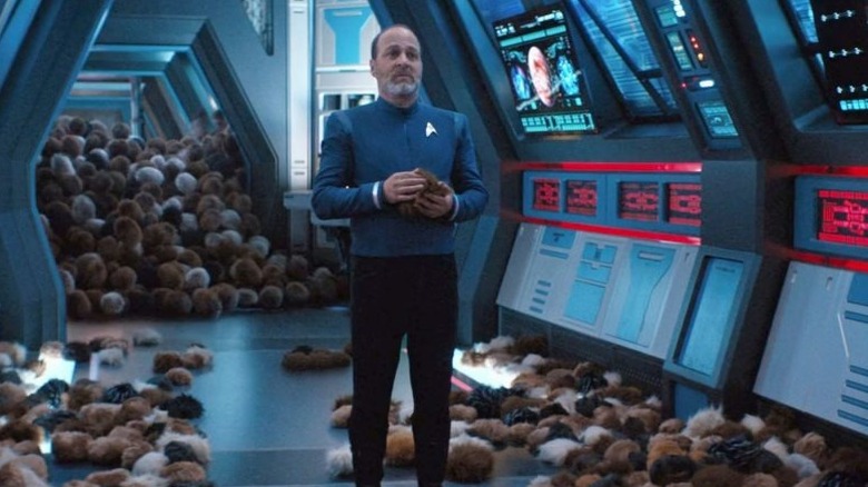 Edward stands in the corridor surrounded by Tribbles in Star Trek: Short Treks