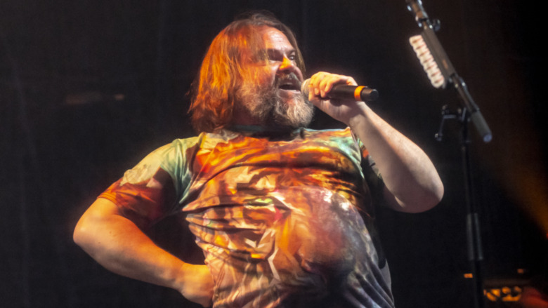 Jack Black on stage in a tie-dye shirt