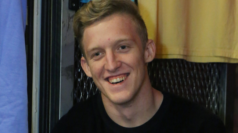 Tfue smiling at an autograph event