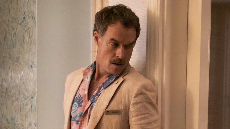 Armond hiding behind a wall in 