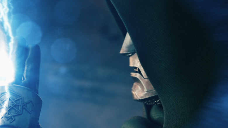 Doctor Doom raises two fingers to ward off Thor in 