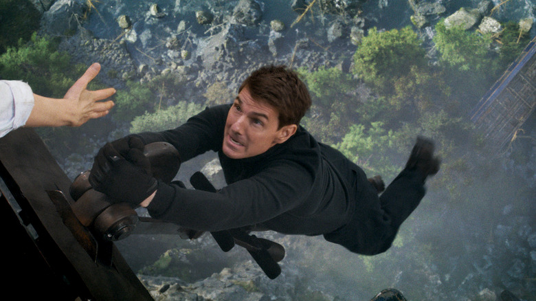 Ethan Hunt hanging off a plane