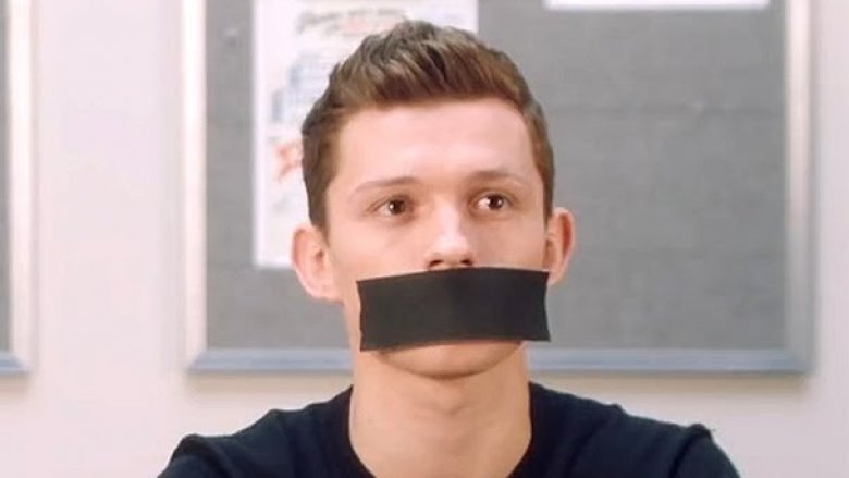 Tom Holland with his mouth taped shut