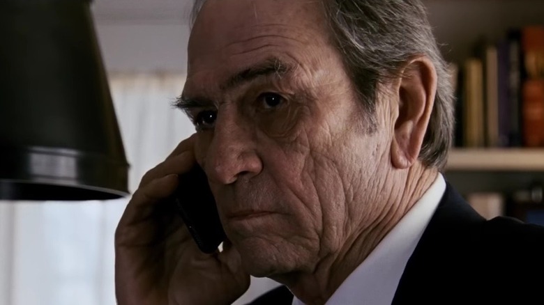 Tommy Lee Jones makes a call in Jason Bourne
