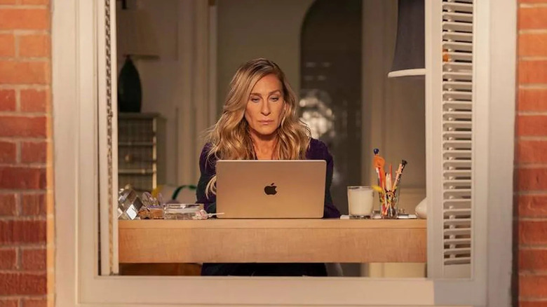 Carrie writing on her computer in "...And Just Like That"