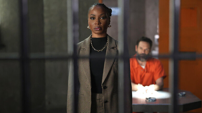 Gabi stands in front of Sir behind bars in "Found"