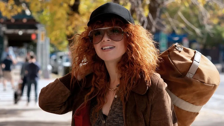 Charlie Cale jauntily carries a bag with her in "Poker Face"