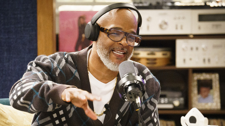Pops talking on his podcast in "Poppa's House"