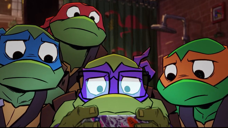 Michelangelo Leonardo Donatello and Raphael gather around in dismay in "Tales of the Teenage Mutant Ninja Turtles"