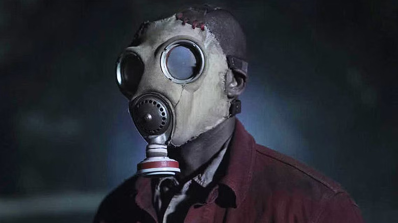 Gas Mask man staring in "Teacup"