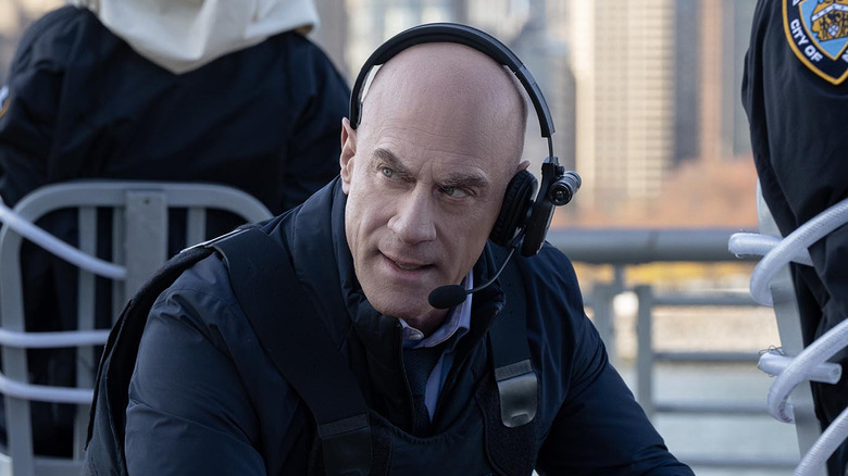 Elliott Stabler kneels at a crime scene in "Law & Order: Organized Crime"