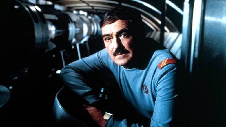 Scotty leaning over in ship in 