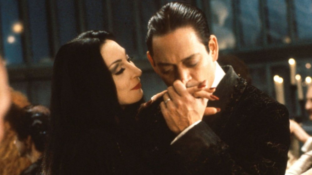 Anjelica Huston and Raul Julia