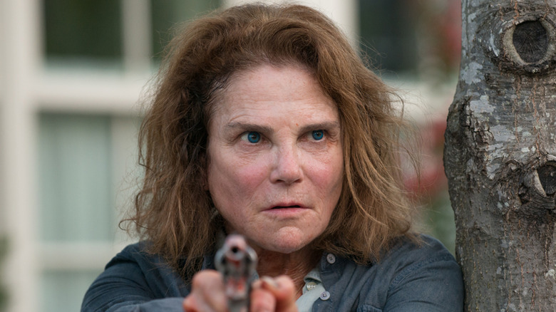 Beth points gun