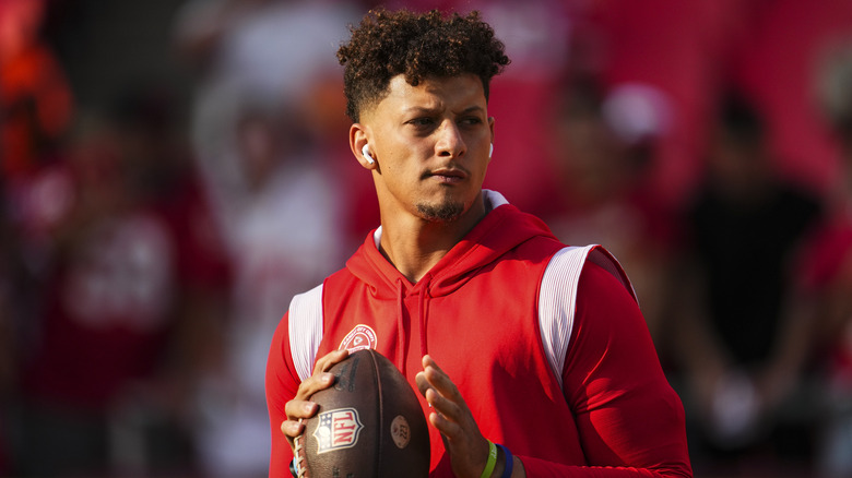 Patrick Mahomes holding football