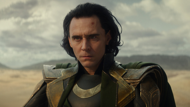 Loki sitting in the middle of the desert on Loki