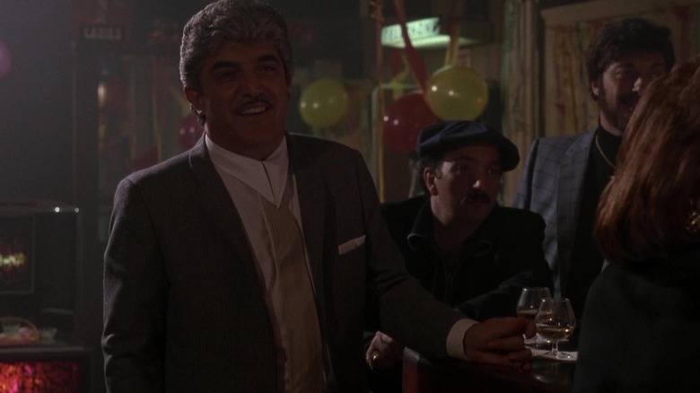 Billy Batts talking at a party