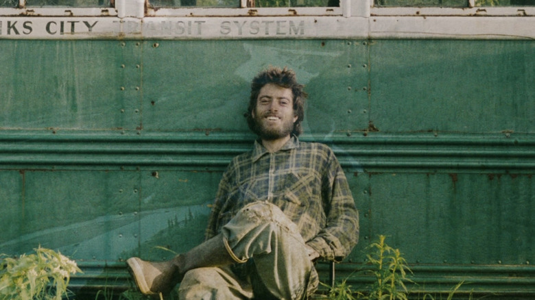 Chris smiles at the camera