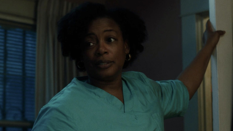 Oracene dressed in scrubs