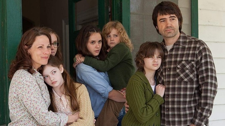 The Perron family in the film standing on their porch